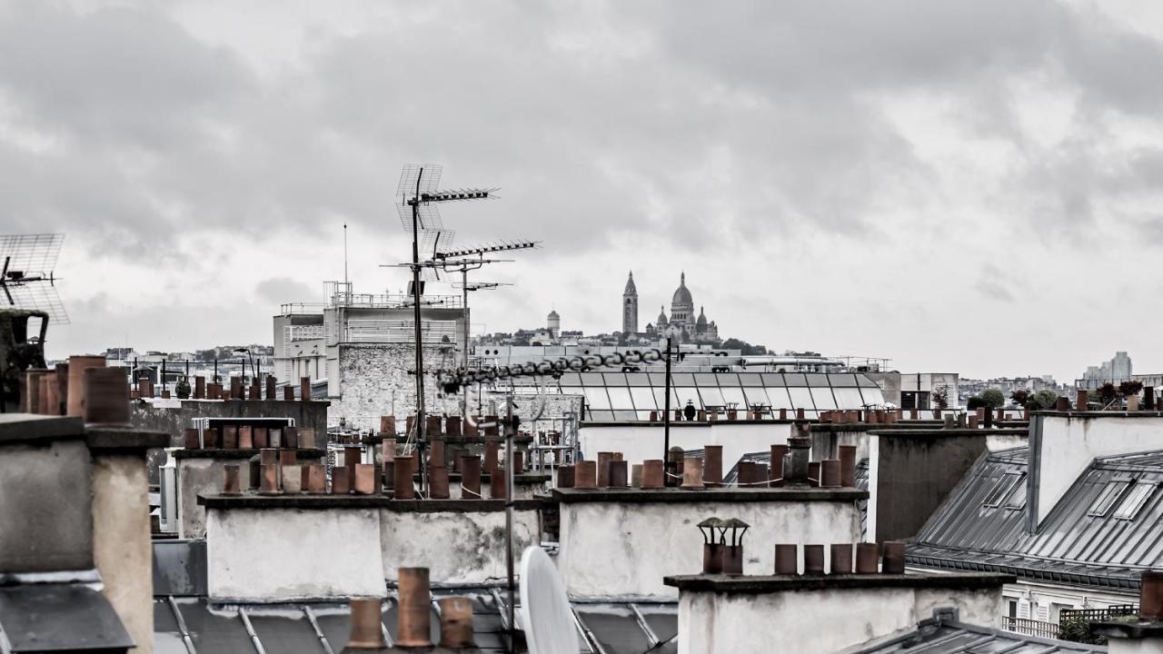 เมอซิเยอ ฌอร์จ โฮเทล แอนด์ สปา - ช็องเซลิเซ่ Hotel ปารีส ภายนอก รูปภาพ View of Paris rooftops